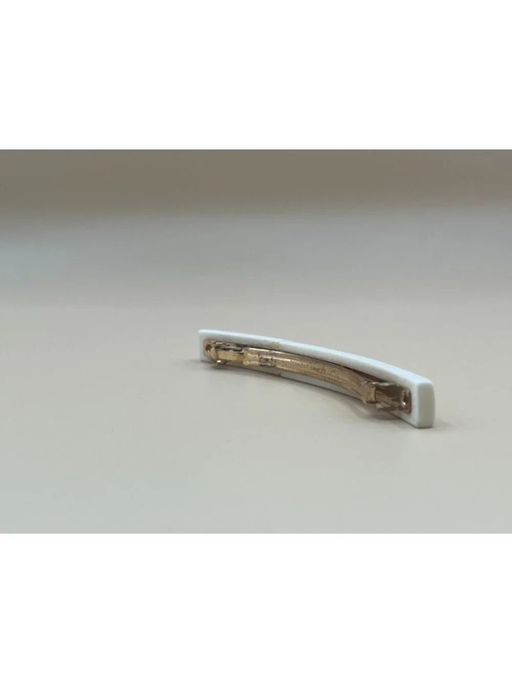 Authentic vintage Chanel bar barrette in cream-white resin, printed with two red